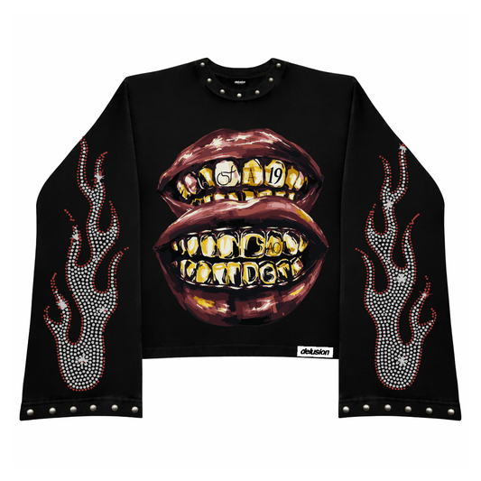 Black long-sleeve shirt with gold teeth and flames design on a white background