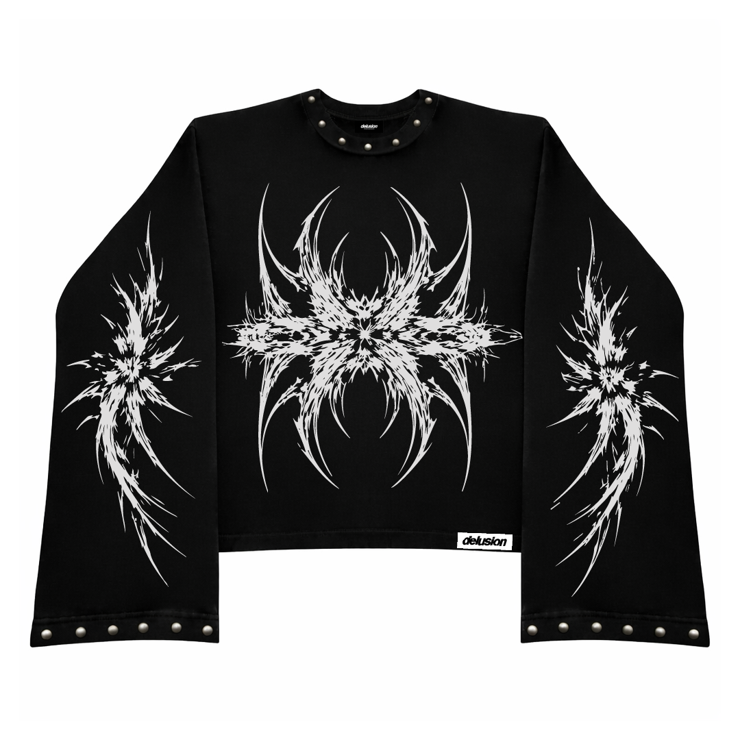 Black long-sleeve crop top with white abstract designs on a white background