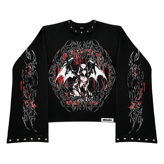A black long-sleeve crop top sweatshirt featuring a large gothic graphic of a winged demon on the chest, matching graphic prints on both sleeves, and silver metal studs along the collar, cuffs, and hem.