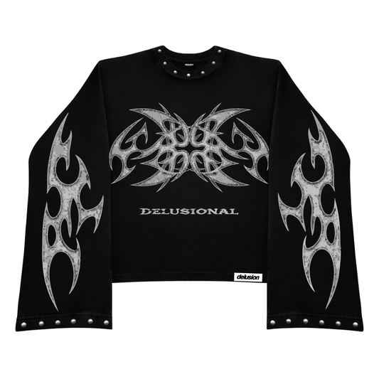 Black long-sleeve crop top with tribal designs and 'Delusional' branding on a white background