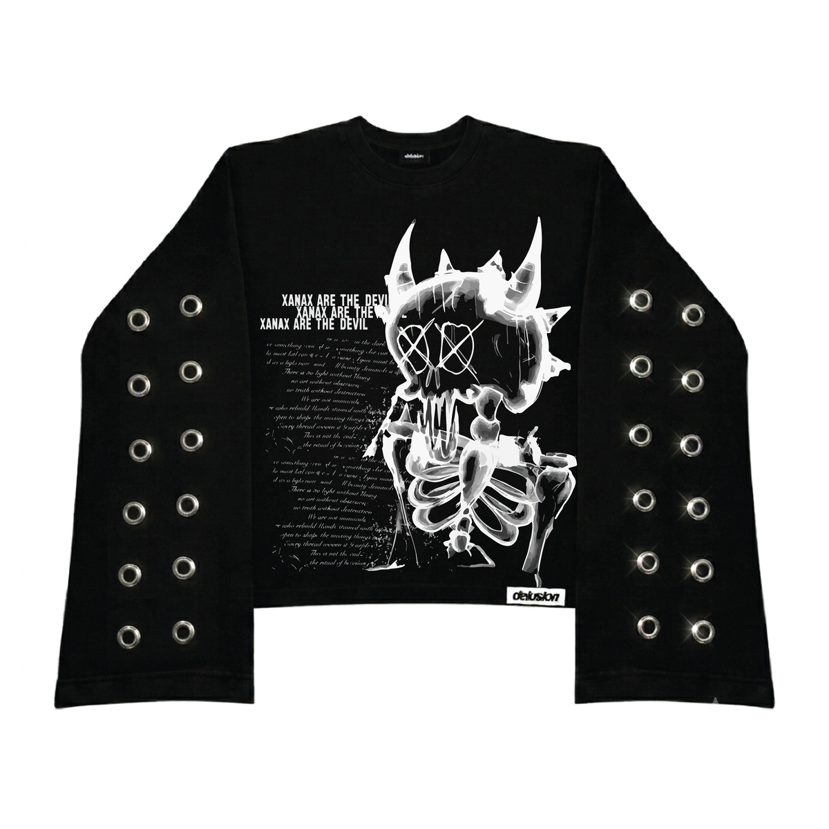 A black long-sleeve crop top sweatshirt featuring a large white graphic of a horned skull and skeleton on the front, with text on the left side. The sleeves are decorated with multiple rows of silver metal grommets, and a small 'Delusion' brand label is visible near the bottom right hem.